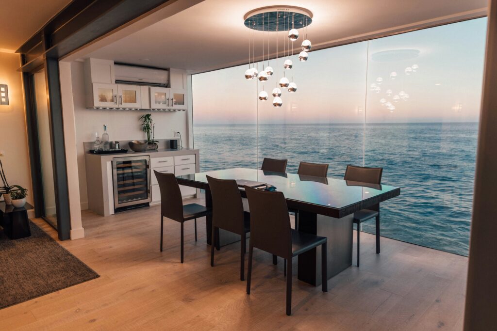 Picture of a dining table behind sea